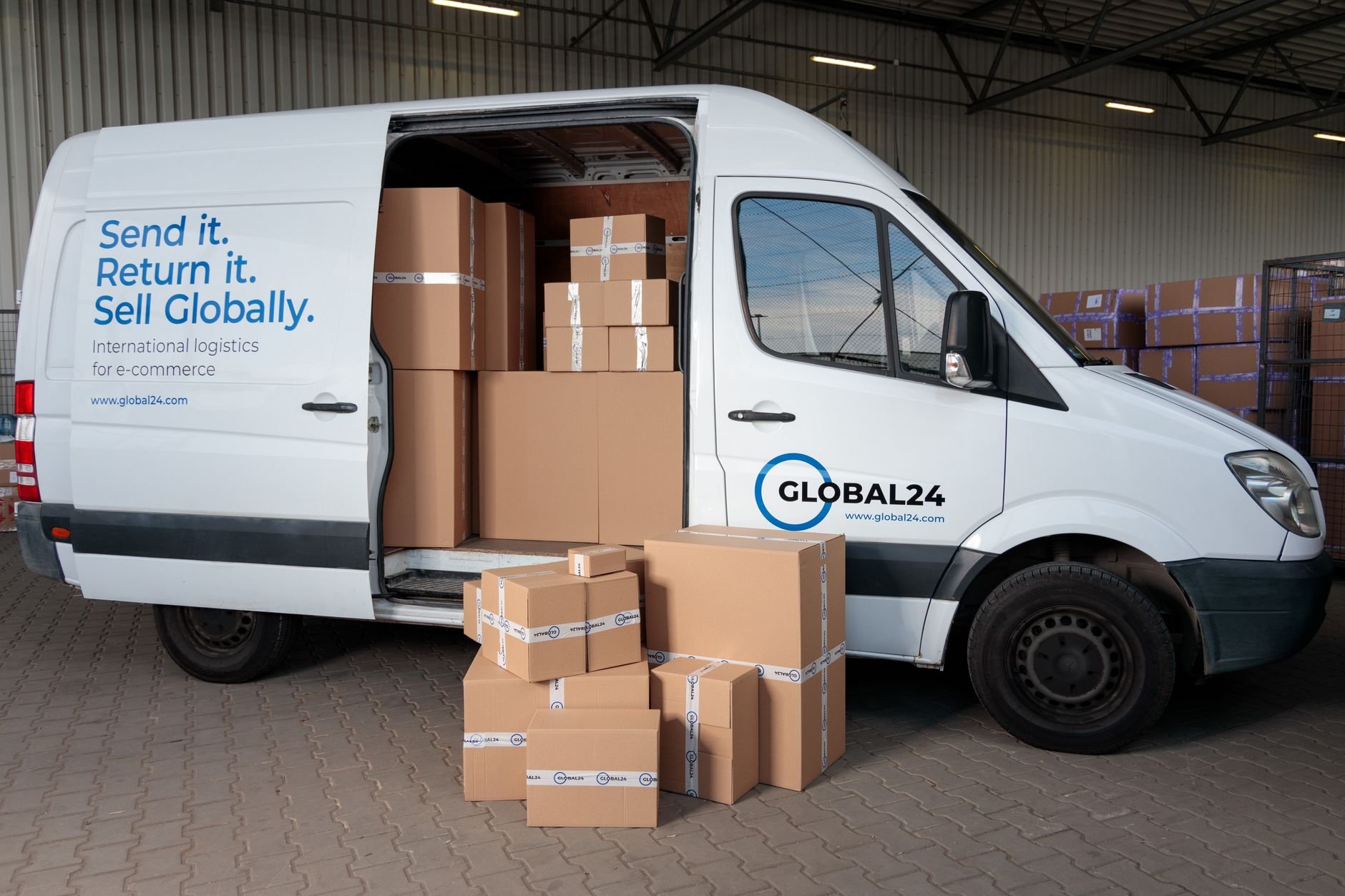 Delivery van loaded with cardboard boxes for global shipping logistics.